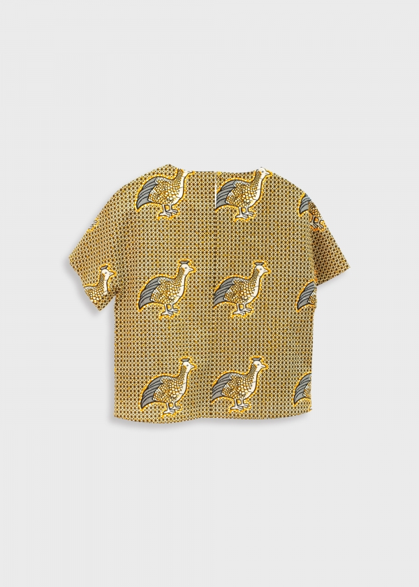 Gold bird on the print shirt